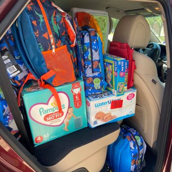 backpacks and diapers in car